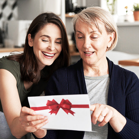 mother's day gifts collection, mother and daughter looking at gift certificate