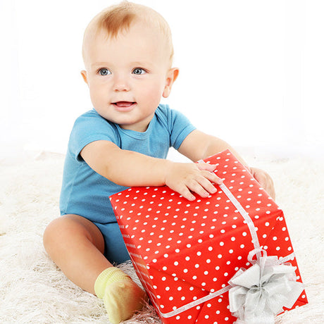 gifts for baby collection, baby holding red gift