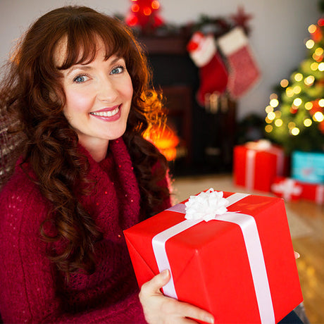 gifts for her collection, female holding red gift